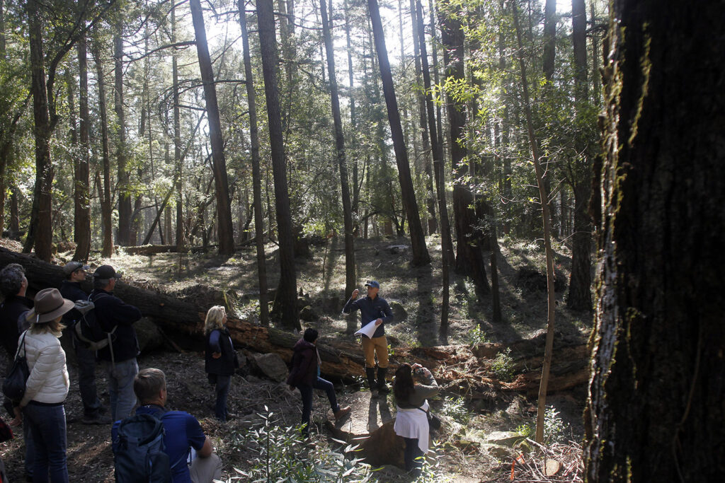 Stewardship Program Manager Mike Palladini describes the project to local leaders.